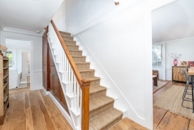 319 Main St, Wethersfield, CT 06109 - staircase featuring hardwood / wood-style flooring and crown molding