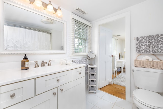 319 Main St, Wethersfield, CT 06109 - bathroom with vanity and tile patterned flooring