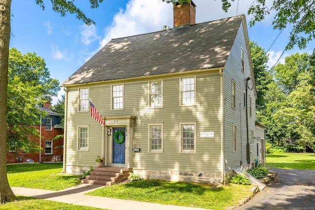 319 Main St, Wethersfield, CT 06109 - view of front of home featuring a chimney, a front lawn, and a shingled roof