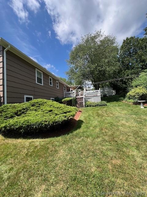 38 Pine St, Trumbull, CT 06611 - view of grassy yard featuring a deck