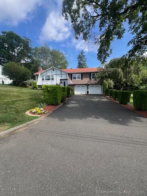 38 Pine St, Trumbull, CT 06611 - view of front of property featuring asphalt driveway and a front yard