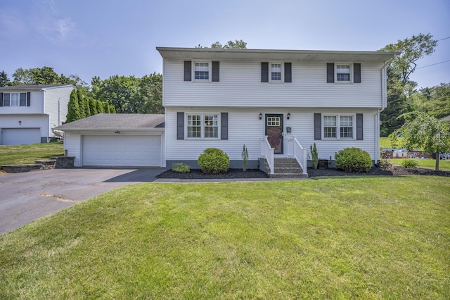 18 Holly Ln, Wallingford, CT 06492 - colonial inspired home featuring a front lawn and a garage