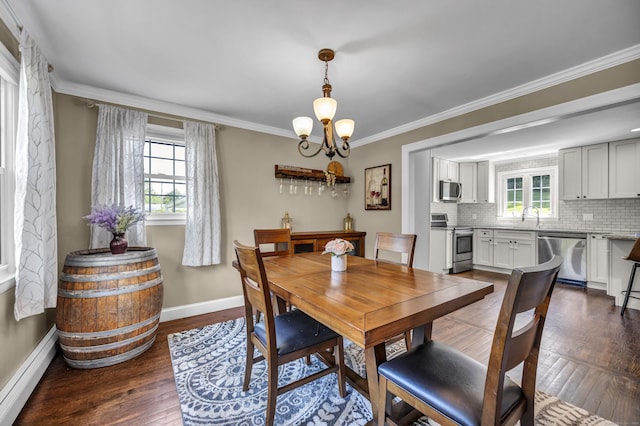 18 Holly Ln, Wallingford, CT 06492 - dining room featuring baseboard heating, plenty of natural light, a chandelier, dark wood-style floors, and crown molding
