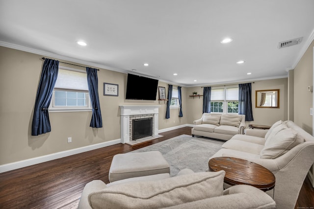 18 Holly Ln, Wallingford, CT 06492 - living area featuring crown molding, wood finished floors, recessed lighting, and a brick fireplace