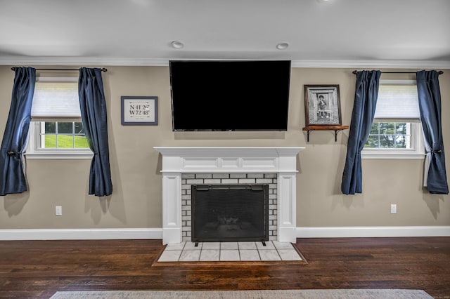 18 Holly Ln, Wallingford, CT 06492 - living room with wood finished floors, plenty of natural light, ornamental molding, a tiled fireplace, and recessed lighting