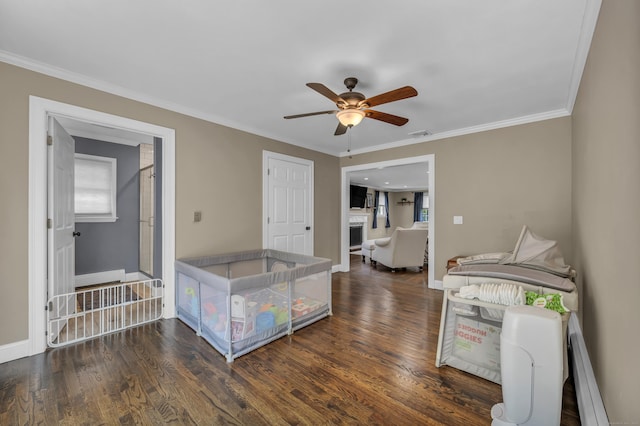 18 Holly Ln, Wallingford, CT 06492 - interior space featuring ceiling fan, a fireplace, a baseboard radiator, healthy amount of natural light, and ornamental molding