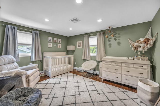 18 Holly Ln, Wallingford, CT 06492 - bedroom with recessed lighting, wood finished floors, and a nursery area