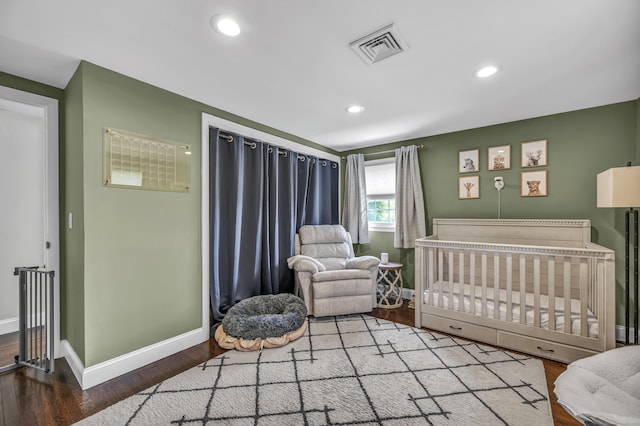18 Holly Ln, Wallingford, CT 06492 - bedroom featuring wood finished floors, recessed lighting, and a crib