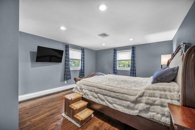 18 Holly Ln, Wallingford, CT 06492 - bedroom with baseboard heating, wood finished floors, and recessed lighting
