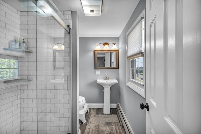 18 Holly Ln, Wallingford, CT 06492 - bathroom featuring a baseboard radiator, a stall shower, and wood finished floors