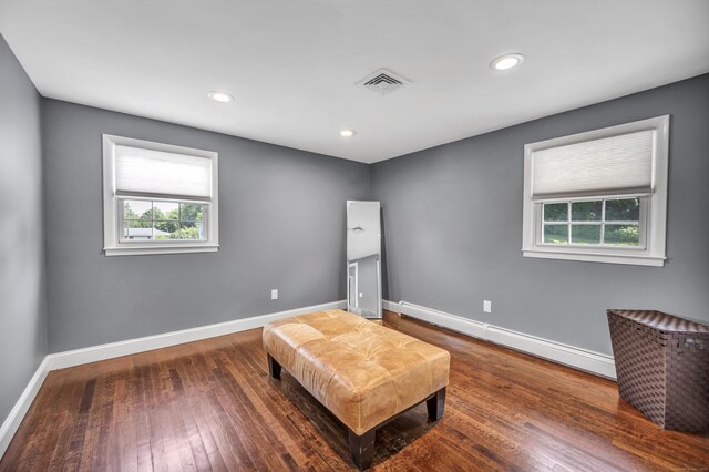 18 Holly Ln, Wallingford, CT 06492 - unfurnished room featuring a baseboard radiator, wood finished floors, and recessed lighting