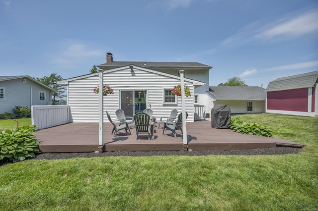18 Holly Ln, Wallingford, CT 06492 - back of property with a chimney, a shed, a yard, and a wooden deck