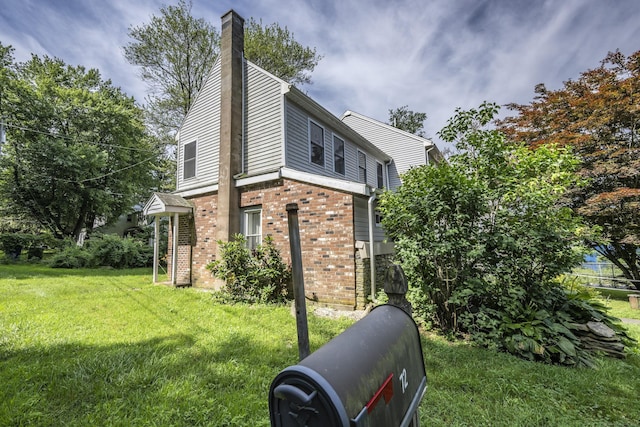 72 S Rd, Portland, CT 06480 - view of side of home with brick siding, a yard, and a chimney