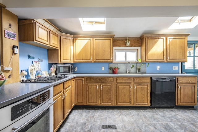 72 S Rd, Portland, CT 06480 - kitchen with stainless steel appliances, plenty of natural light, and brown cabinets