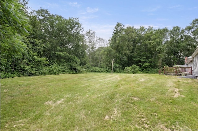 29 Cheney Rd, Pomfret, CT 06259 - view of green lawn featuring a wooden deck and a forest view