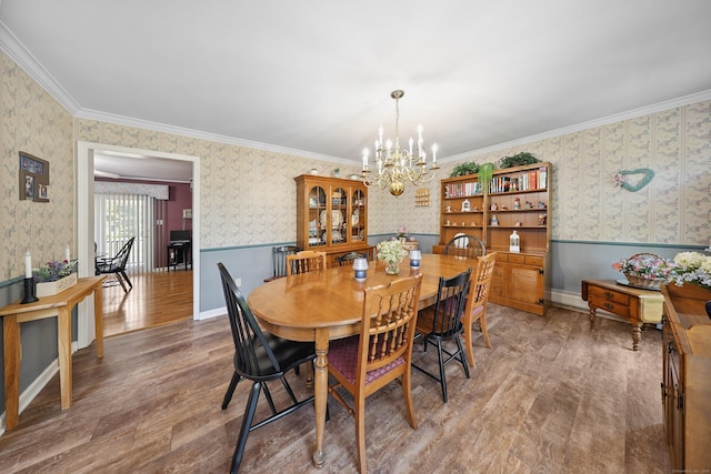 21 Hidden Pond Dr, Watertown, CT 06795 - dining space with wallpapered walls, a chandelier, wood finished floors, and wainscoting