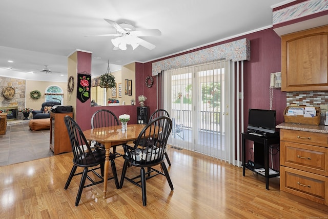 21 Hidden Pond Dr, Watertown, CT 06795 - dining area featuring a ceiling fan, ornamental molding, light wood-type flooring, and a fireplace