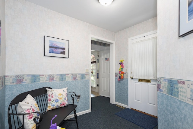 21 Hidden Pond Dr, Watertown, CT 06795 - living area with wallpapered walls and dark colored carpet