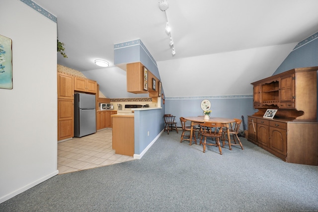 21 Hidden Pond Dr, Watertown, CT 06795 - kitchen with freestanding refrigerator, lofted ceiling, light carpet, open shelves, and a peninsula