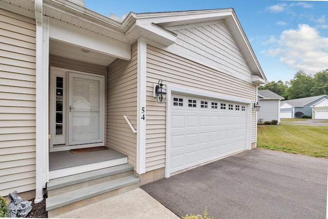 54 Pondview Cir Unit 54, Beacon Falls, CT 06403 - property entrance with a garage and asphalt driveway