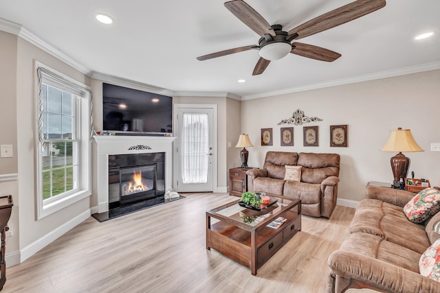 54 Pondview Cir Unit 54, Beacon Falls, CT 06403 - living room with plenty of natural light, a glass covered fireplace, ornamental molding, a ceiling fan, and recessed lighting
