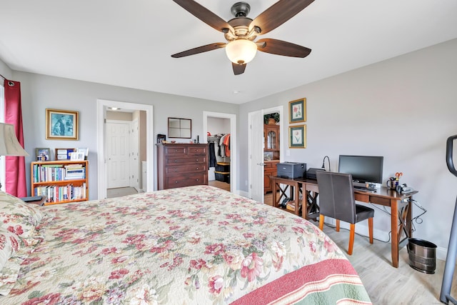 54 Pondview Cir Unit 54, Beacon Falls, CT 06403 - bedroom featuring wood finished floors, a walk in closet, a ceiling fan, and a desk