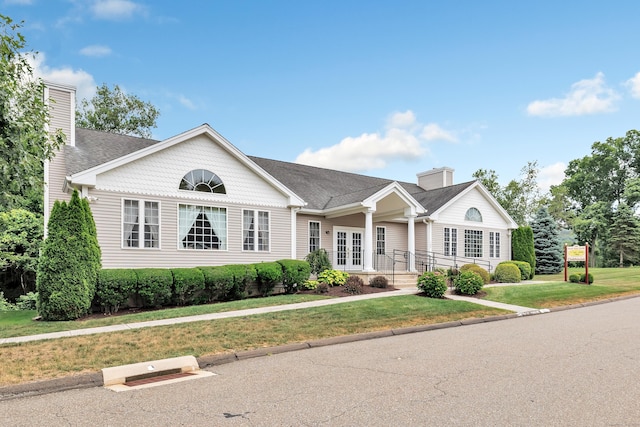 54 Pondview Cir Unit 54, Beacon Falls, CT 06403 - view of front of house with a chimney, a front yard, french doors, and roof with shingles
