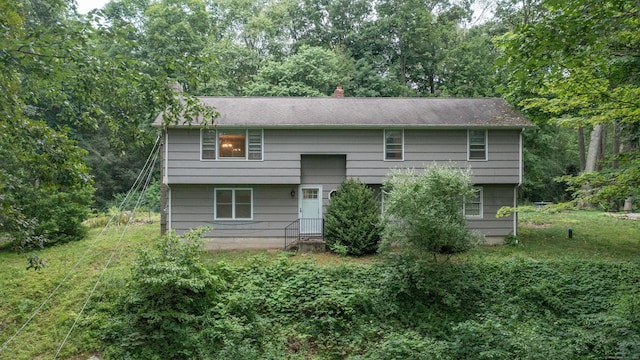 16 Skidmore Ln, Newtown, CT 06482 - back of property with a chimney