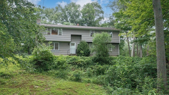 16 Skidmore Ln, Newtown, CT 06482 - rear view of property with a chimney