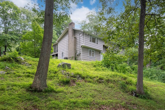 16 Skidmore Ln, Newtown, CT 06482 - view of property exterior featuring a chimney