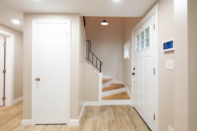 16 Skidmore Ln, Newtown, CT 06482 - entrance foyer featuring light wood-style flooring and stairs