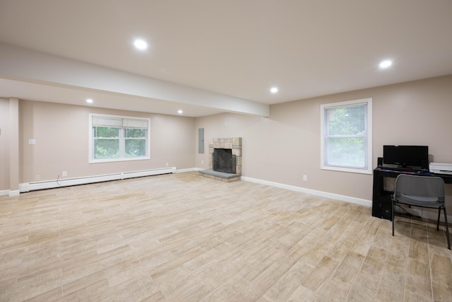 16 Skidmore Ln, Newtown, CT 06482 - unfurnished living room featuring a baseboard radiator, light wood finished floors, a stone fireplace, recessed lighting, and an office area