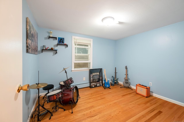 16 Skidmore Ln, Newtown, CT 06482 - miscellaneous room with wood finished floors and a baseboard radiator