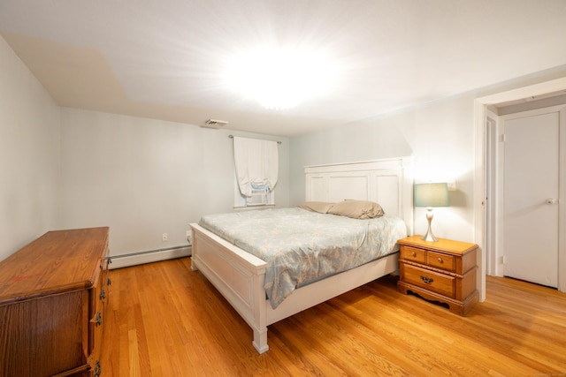 16 Skidmore Ln, Newtown, CT 06482 - bedroom featuring a baseboard radiator and light wood-style floors
