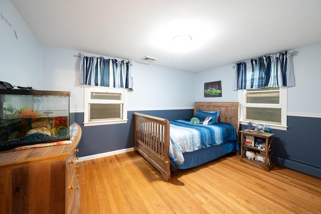 16 Skidmore Ln, Newtown, CT 06482 - bedroom featuring wood finished floors and baseboard heating