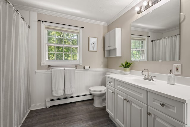 84 Kanungum Trl, Shelton, CT 06484 - bathroom with a baseboard radiator, vanity, a wainscoted wall, wood finished floors, and crown molding
