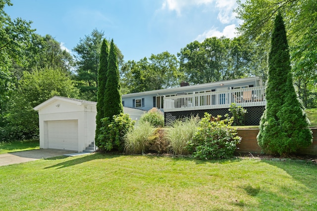 84 Kanungum Trl, Shelton, CT 06484 - view of front of home featuring a front yard, concrete driveway, a garage, and an outbuilding