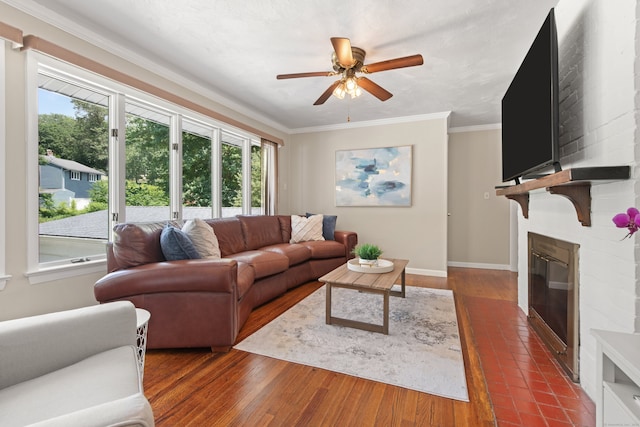 84 Kanungum Trl, Shelton, CT 06484 - living area with a fireplace, healthy amount of natural light, a ceiling fan, crown molding, and dark wood finished floors