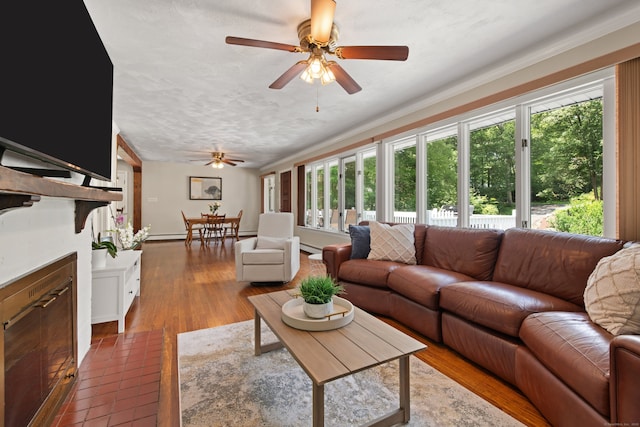84 Kanungum Trl, Shelton, CT 06484 - living area with a ceiling fan and a fireplace