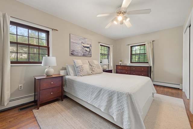 84 Kanungum Trl, Shelton, CT 06484 - bedroom featuring a baseboard radiator, wood finished floors, and a ceiling fan