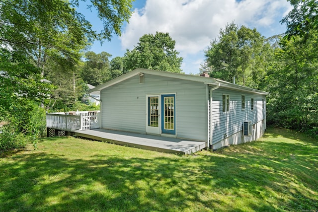 84 Kanungum Trl, Shelton, CT 06484 - rear view of house featuring a lawn, a chimney, and a wooden deck