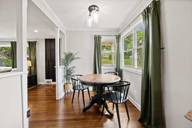 96 Douglas Dr, Meriden, CT 06451 - dining room with dark wood-style flooring, crown molding, decorative columns, and recessed lighting