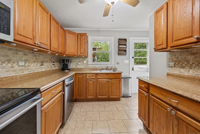 96 Douglas Dr, Meriden, CT 06451 - kitchen featuring stainless steel appliances, crown molding, a ceiling fan, tasteful backsplash, and brown cabinets