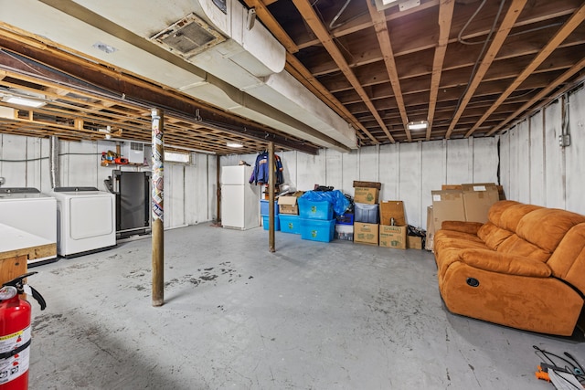 96 Douglas Dr, Meriden, CT 06451 - unfinished below grade area with freestanding refrigerator and independent washer and dryer