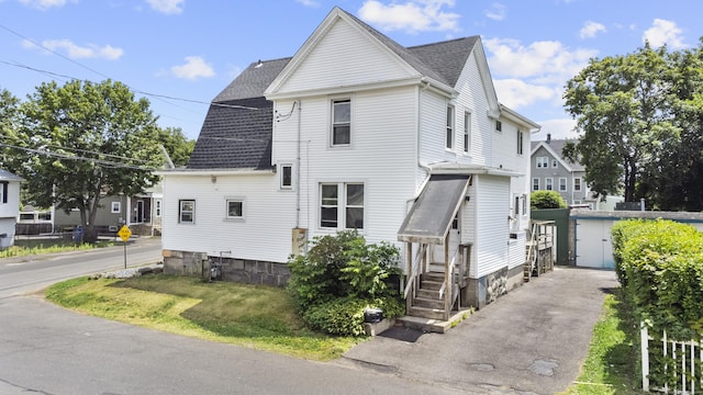 124 Geddes Ter, Waterbury, CT 06708 - view of side of property featuring a shingled roof
