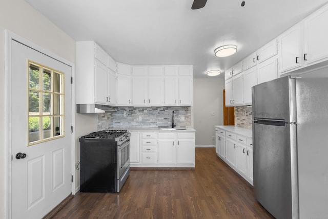 124 Geddes Ter, Waterbury, CT 06708 - kitchen featuring stainless steel appliances, dark wood finished floors, light countertops, and decorative backsplash