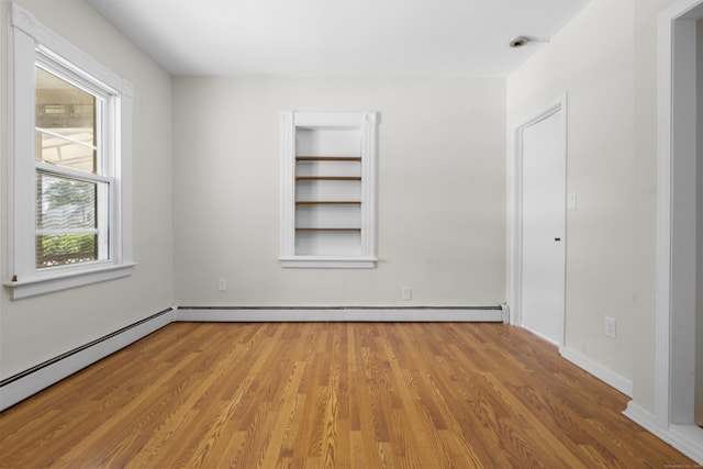 124 Geddes Ter, Waterbury, CT 06708 - spare room featuring wood finished floors and baseboard heating