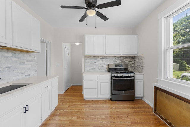 124 Geddes Ter, Waterbury, CT 06708 - kitchen with stainless steel gas range oven, light countertops, tasteful backsplash, and ceiling fan