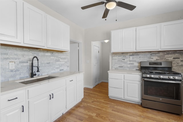 124 Geddes Ter, Waterbury, CT 06708 - kitchen featuring stainless steel gas stove, light countertops, tasteful backsplash, and a ceiling fan