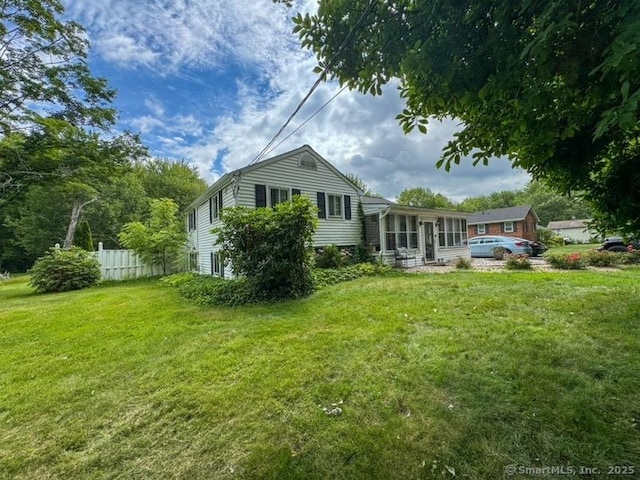 860 Suffield St, Suffield, CT 06078 - back of house featuring a sunroom